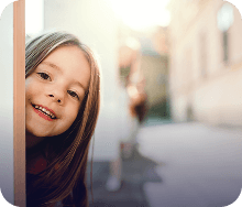 kid peaking behind wall