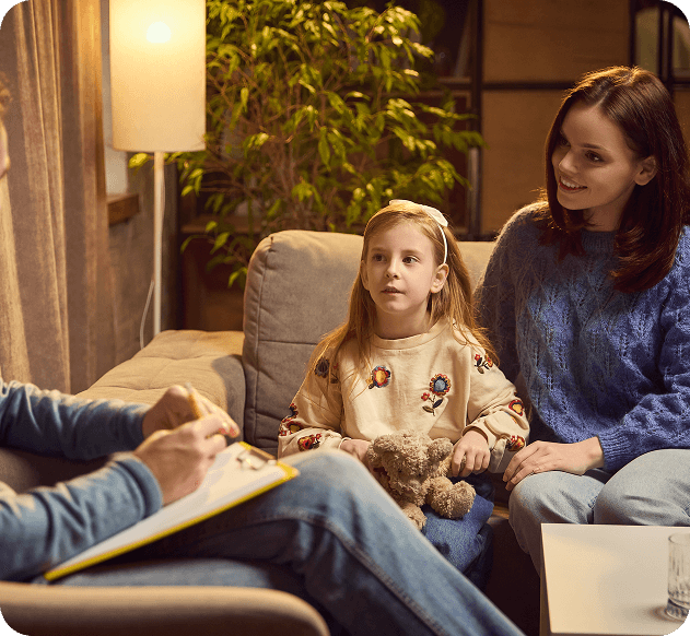 parent with kid in a therapy session