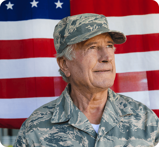 veteran with the US flag in the background